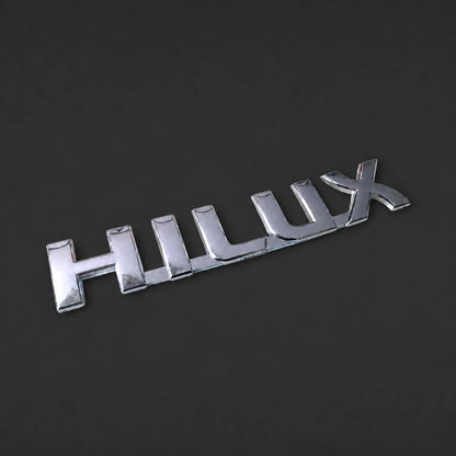Emblema Toyota Hilux 19x3.3cm. [IRP-CATALOG:INSI006-GALLERY-1-O.webp:e97d4d1c93c3e9d9]