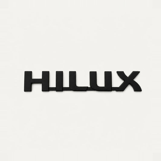 Hilux Emblema Negro Mate Toyota 19x3.3cm. [IRP-CATALOG:INSI012-1-C.webp:d202328623aa27bd]
