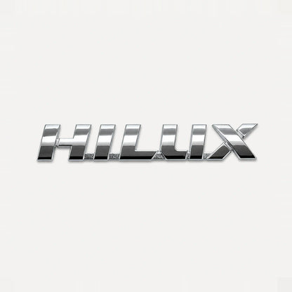 Emblema Toyota Hilux Linea Nueva 2016-2025. [IRP-CATALOG:INSI029-1-C.webp:fe25b3efc8b8f1d4]
