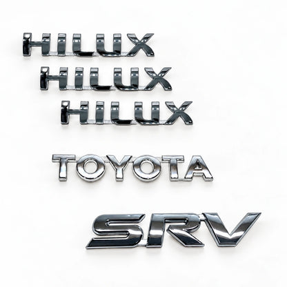 Kit Emblemas Traseros y Laterales para Toyota Hilux Srv 05-15. [IRP-CATALOG:KIT-X5-EMB-SRV-05-15-GALLERY-4-C-4679711759ae0cf3.webp:4679711759ae0cf3]